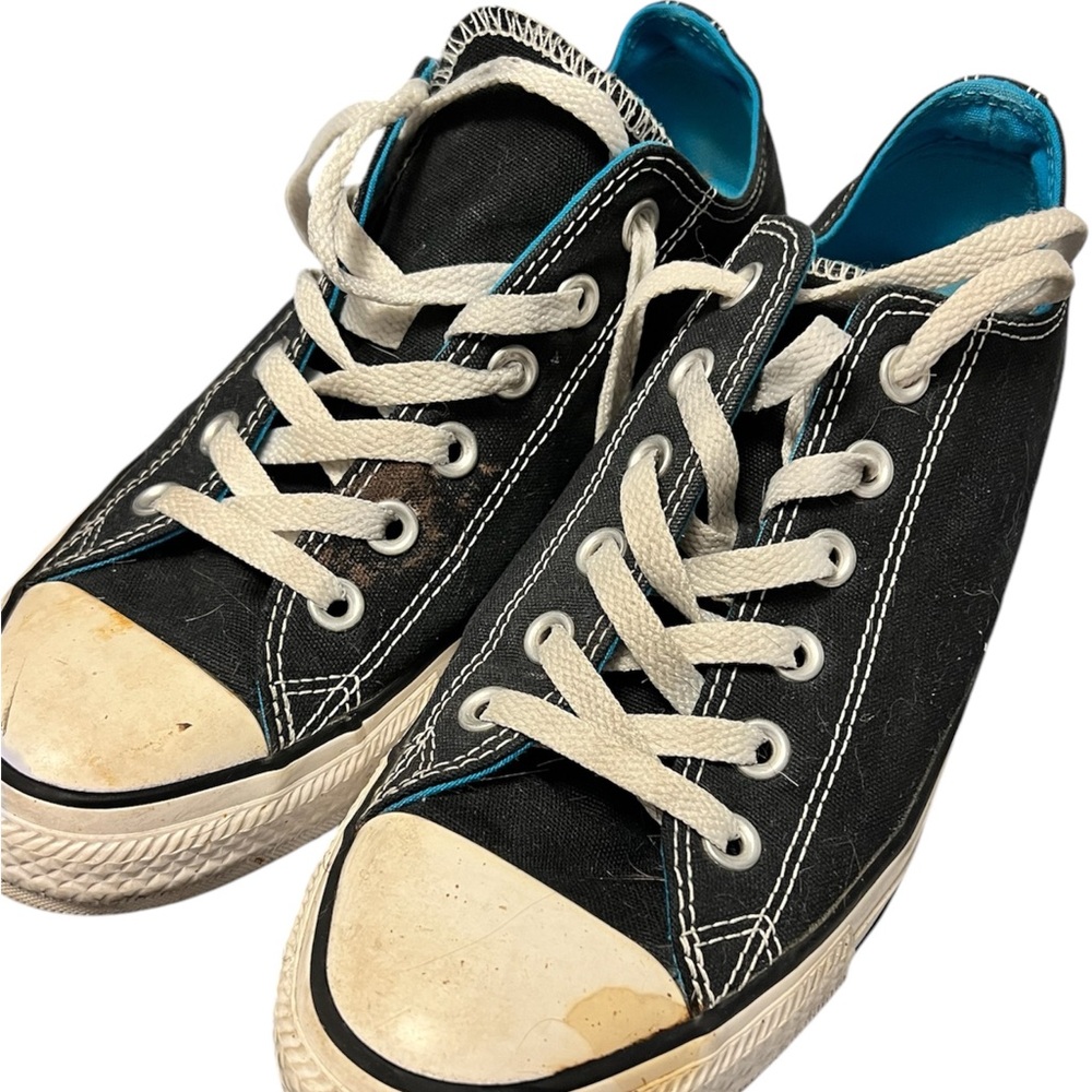 Black Converse Sneakers with White Laces. Worn